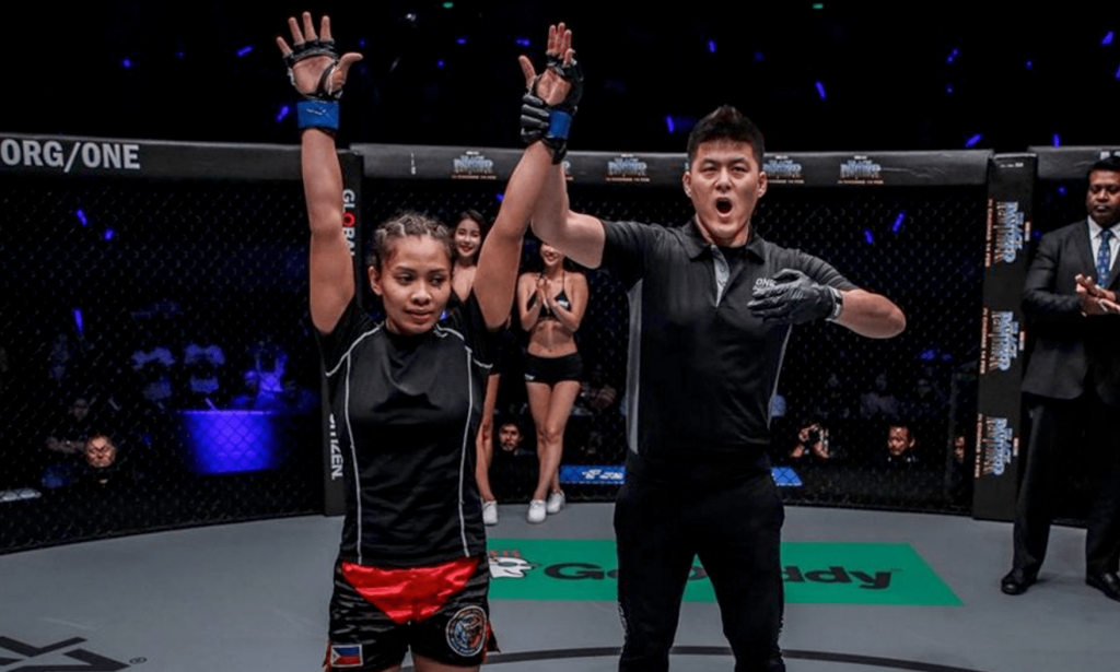 Jomary Torres celebrating win in ONE Championship cage